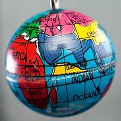Macro of tiny Earth globe hanging on key chain
